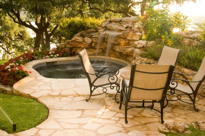 patio with a pond and a small waterfall