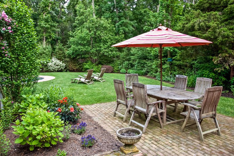 small stylish patio with dining area and umbrella